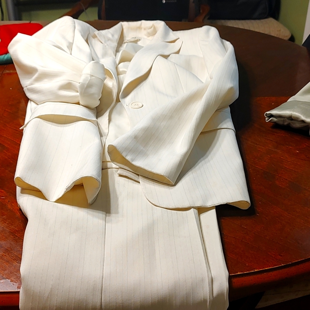 A beautiful cream suit with sage pin stripe